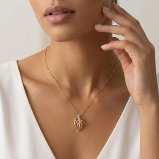 Glittering Leaf Charm Gold Necklace worn around neck – Shop Online at Keyona Jewellery