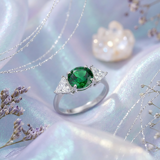 Emerald Glow Three‑Stone Ring